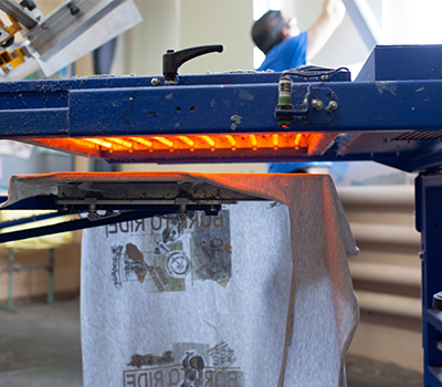 Machine doing Water-based Screen Printing